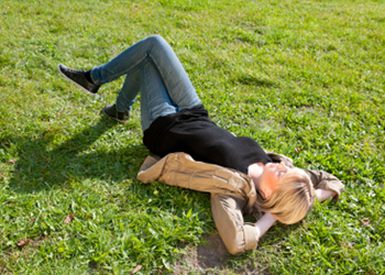 Woman sleeping in field